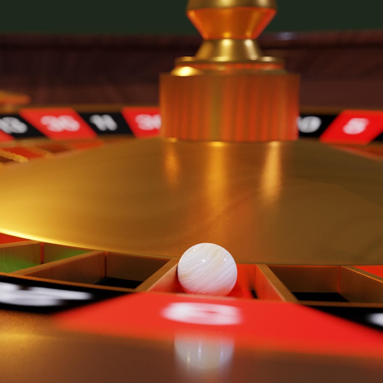 close up of roulette ball on wheel number 3